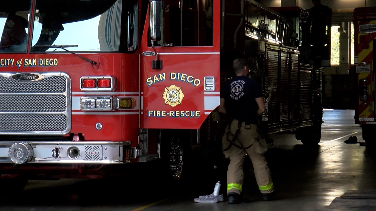 San Diego Fire-Rescue engine and firefighter inside station bay