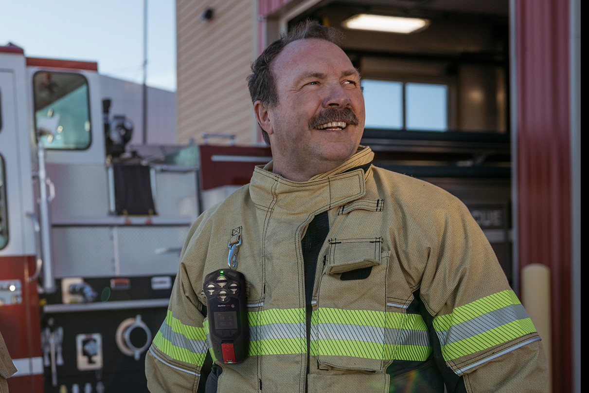 Firefighter wearing Blackline Safety G8 gas detector on turnout gear