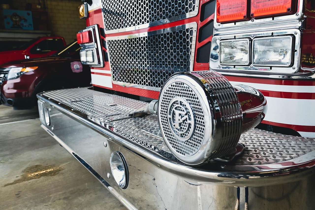 American fire engine and Pierce pumper apparatus in station