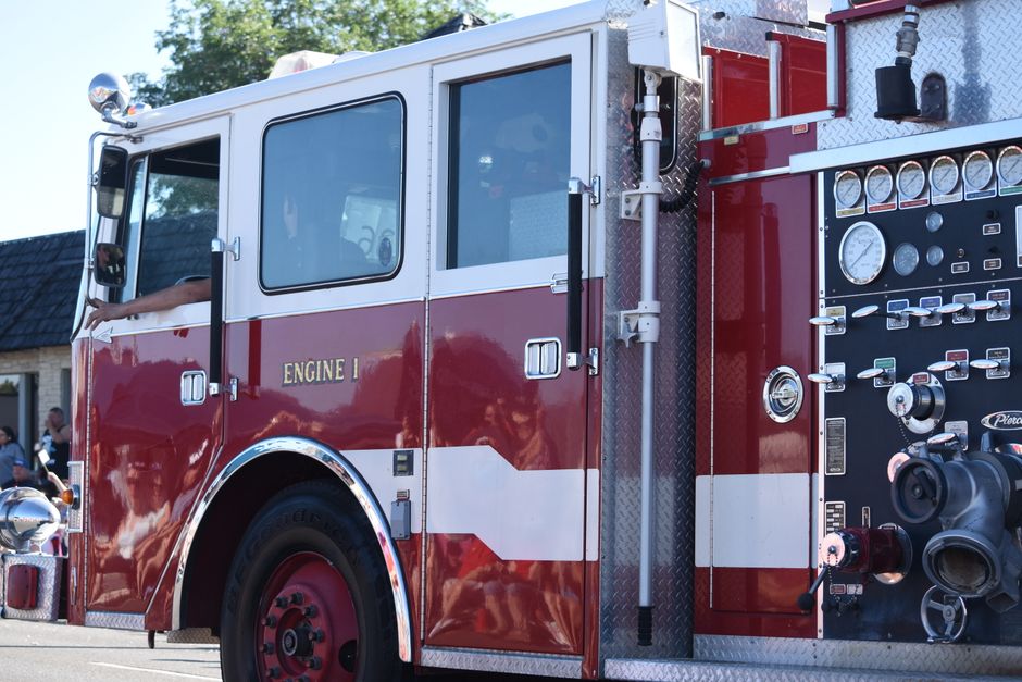 American Pierce fire engine with its pump panel and gauges, labeled Engine 1